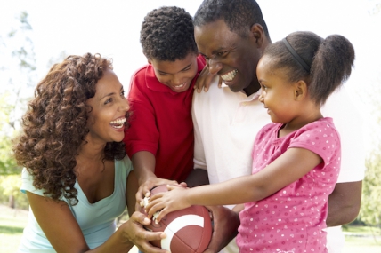 Family playing with football